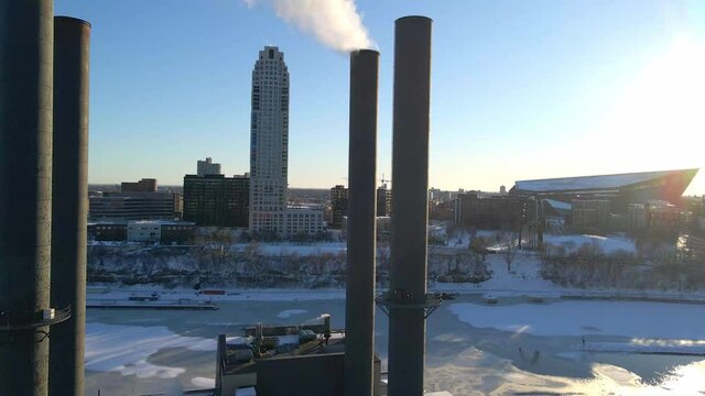 Industry near Minneapolis downtown emitting CO2 green house gas emissions climate crisis global warming