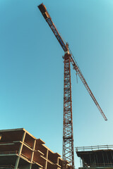 Industrial construction crane in the city.