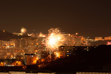 Fireworks in the city at night during New Year celebration. Soft focus background