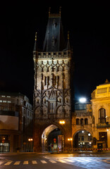 Fototapeta na wymiar Prague at night, Powder gate lit with lights, cityscape
