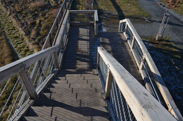 observation tower platform made of oak logs with barrier-free access for seniors and the immobile. zoo safari with a large paddock and terrace for tourists