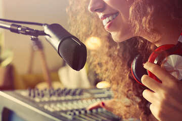 African American woman working as radio host in modern studio, closeup