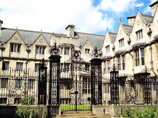 Naklejka premium Merton College Oxford University Oxfordshire UK which could be the oldest in the city and a popular travel destination tourist landmark attraction, stock photo image 