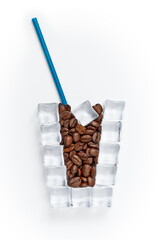 Grains of coffee in a glass made from ice cubes.