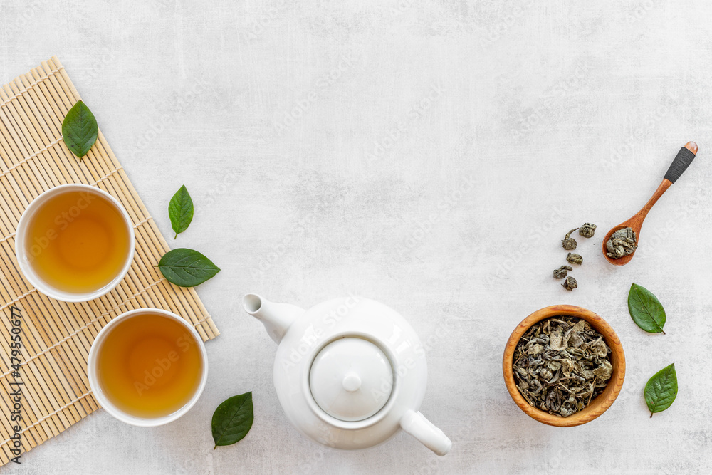 Wall mural Asian tea set with white teapot and two cups, top view