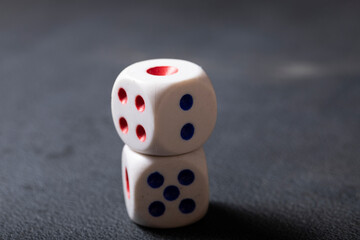 two dice on a black background
