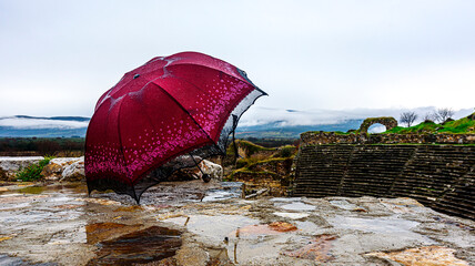 Aphrodisias ancient city and umbrella on a rainy day