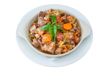 Delicious traditional Portuguese dish feijoada and sewn with smoked sausage with carrots with cabbage and mint leaves. On isolated white background.