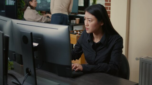 Programer focused on writing code encounters system failure while parsing algorithm sitting at desk in software development office. Coder having unexpected compiling error while creating software.