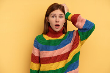 Young English woman isolated on yellow background being shocked, she has remembered important...