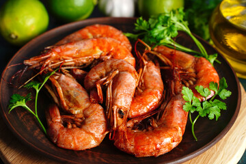 Close up Fried langoustines and shrimps on a plate with parsley. Pickled in garlic and lime. Top view