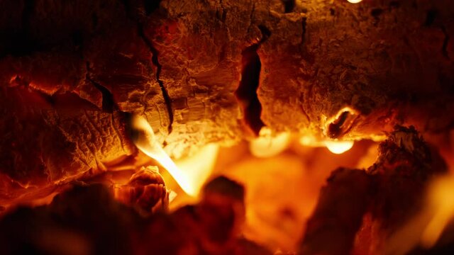 Close up of bonfire burning woods orange flame fireplace 4k clip