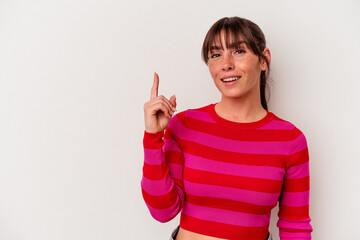 Young Argentinian woman isolated on white background showing number one with finger.