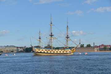 the water an old sailing frigate with guns