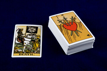 Tarot Card with Deck Isolated on a Blue Table Cover
