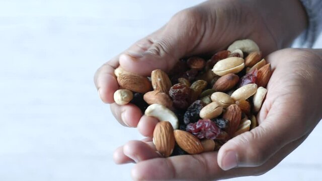 close up of mixed nut on hand with copy space 