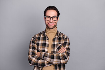 Fototapeta premium Photo of charming cheerful man wear plaid shirt spectacles arms crossed isolated grey color background