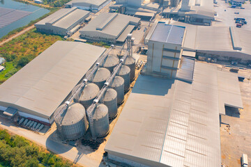 Aerial top view of factory industry. Electricity tower building in energy, transportation, logistic or environment concept. Manufacturing workshop station.