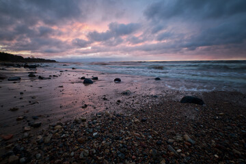 long exposaure sunset stones beach clouds windy