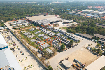 Fototapeta premium Aerial top view of factory industry. Electricity tower building in energy, transportation, logistic or environment concept. Manufacturing workshop station.