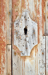Close Up of Keyhole in Old Wooden Door 