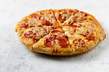 Tasty hot homemade pepperoni pizza. Traditional classic pizza with salami and cheese.