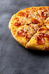 Tasty hot homemade pepperoni pizza. Traditional classic pizza with salami and cheese. With copy space for text.