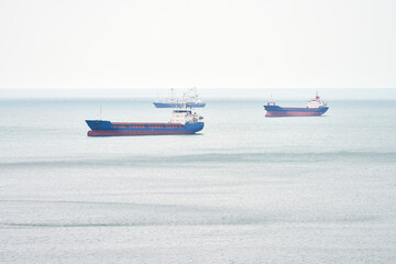 Anchorage of tankers on the approach to the port while waiting for loading. Selective focus.