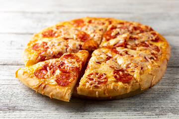 Tasty hot homemade pepperoni pizza. Traditional classic pizza with salami and cheese