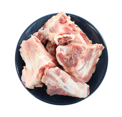 Plate with raw chopped meaty bones isolated on white, top view