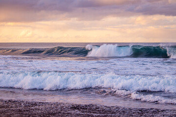 Azores islands, beach with amazing waves and colors, sunset.