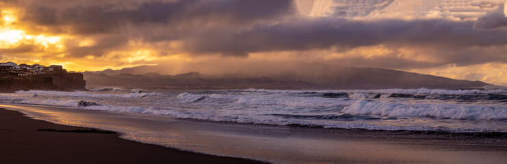 Fototapeta na wymiar Azores islands, beach with amazing waves and colors, sunset.