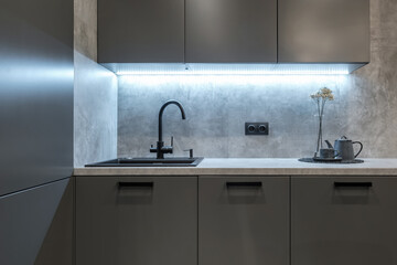 water tap sink with faucet in expensive kitchen