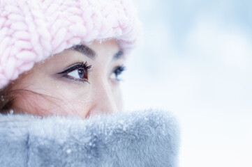 portrait of a person in winter. close-up eyes looking up