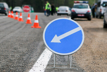 Police checkpoint. A bypass sign on a motor road.