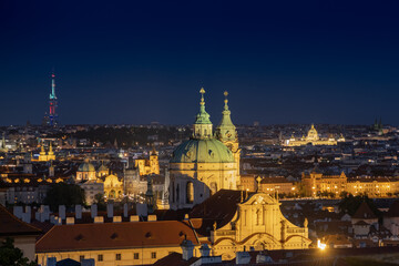 Fototapeta na wymiar Prague city evening landscape scenery, Postcard look above city building with dome in old town.