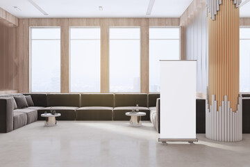 Modern office waiting area with empty white mock up banner, couch, window with city view and...
