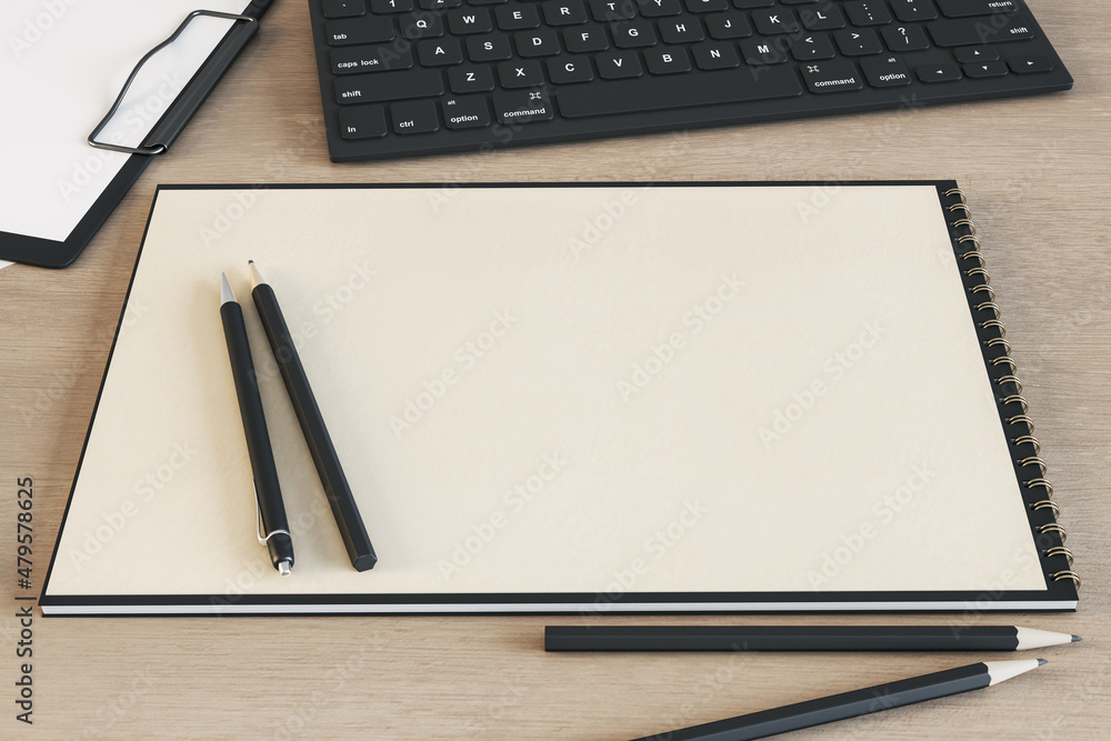 Poster top view of clean spiral notepad on wooden desktop with keyboard and pencils. drawing, workplace, su