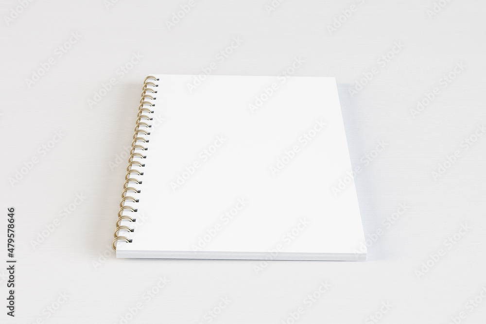 Aufkleber Close up of blank white spiral notepad on light desktop background. Mock up, 3D Rendering.