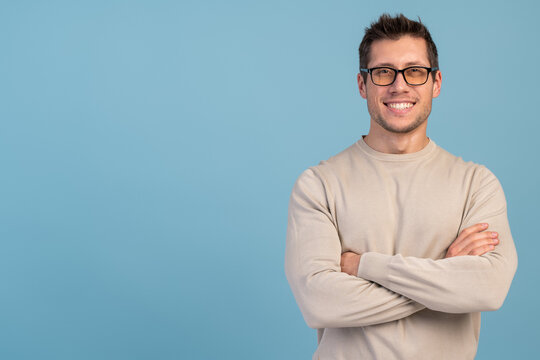 Portrait of nice-looking attractive masculine cheerful bearded guy folded arms isolated over light blue pastel background