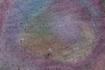 Fragment of asphalt surface or concrete wall decorated with colored crayons as abstract background