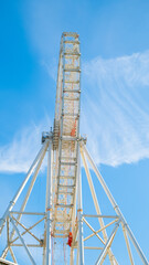 A big Ferris wheel Over Blue Sky in the summer. Front View