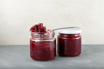 Fried beets in glass  jars. Delicious ingredient for vegetarian salads or borscht. Stewed beetroot