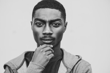 Close up black and white young african American man with thinking expression