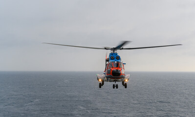 The civil helicopter over the sea