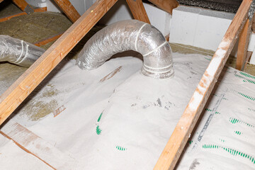 Pipe insulation with expanded perlite in domestic ventilation with energy recovery, a visible...