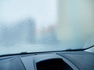 Frozen, icy car windshield. Use of the car in winter and during adverse weather conditions....