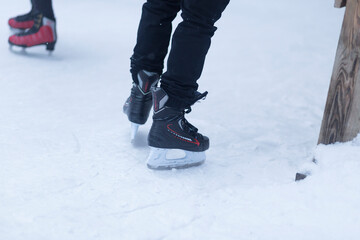 People skate in winter. A special skating rink for ice skating.