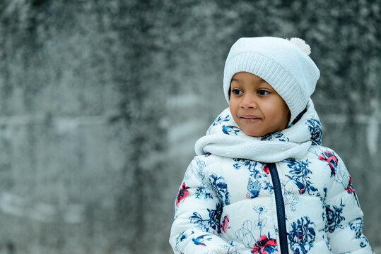 African American Girl In White Winter Outfit Outdoors In The Cold Season