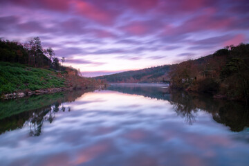 Panoramic photograph of the fagilde dam landscape during sunset, with a fantastic cloudy sky, Mangualde, Portugal